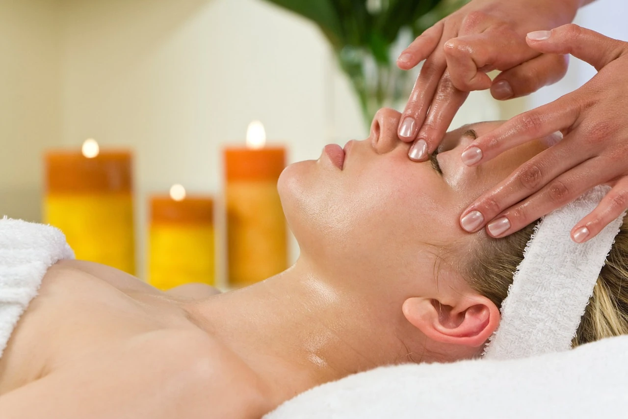 A facial massage step at the spa, one step that can relate to breakouts after a facial